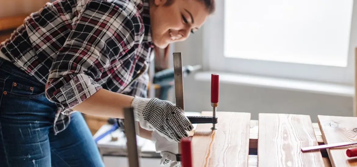 Woman working on her woodworking project